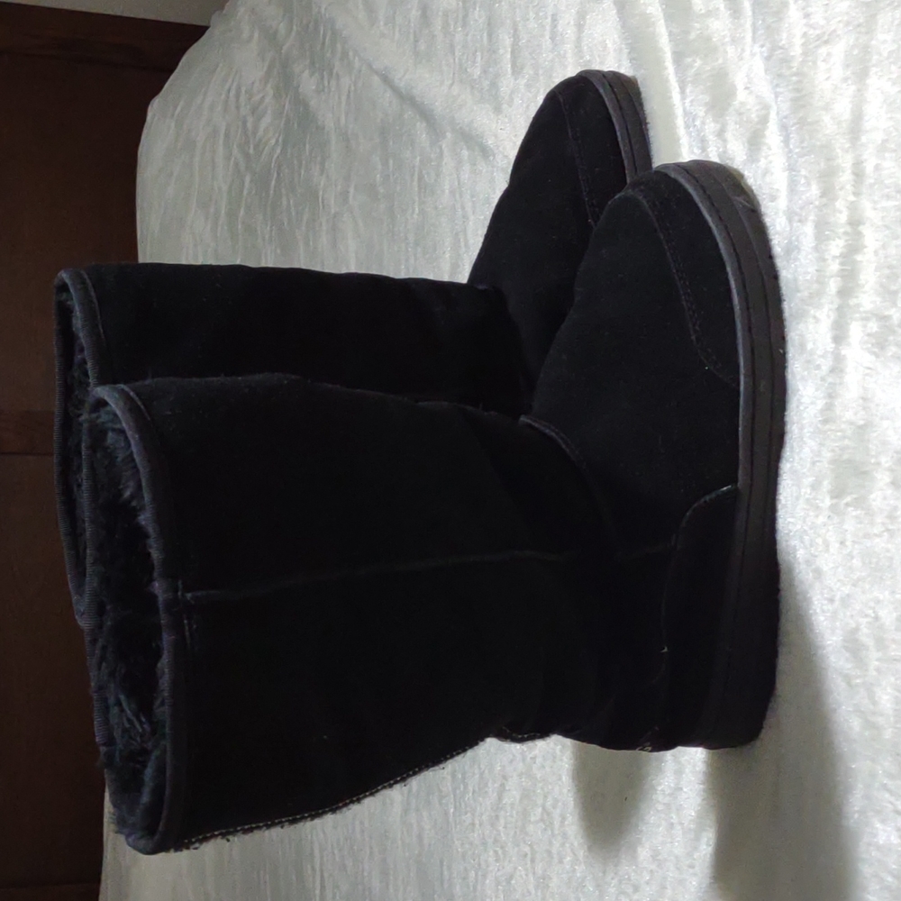 Black Tall UGG boots.